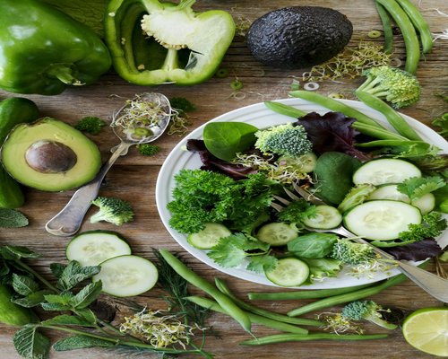 healthy green salad with avocado and seeds